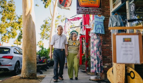 Elderly Asian Couple Walking on the Street