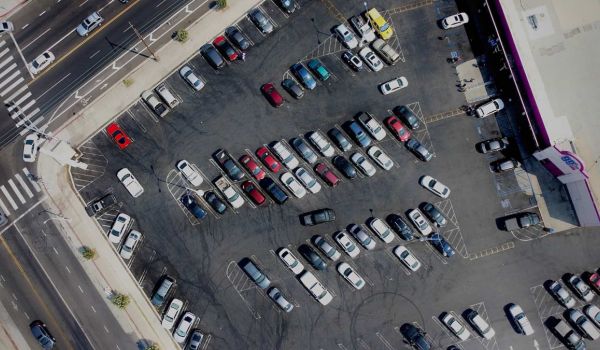 Aerial view of a parking lot in front of a 99 cent store