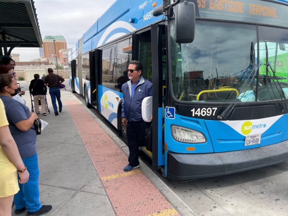 Person steps off a bus